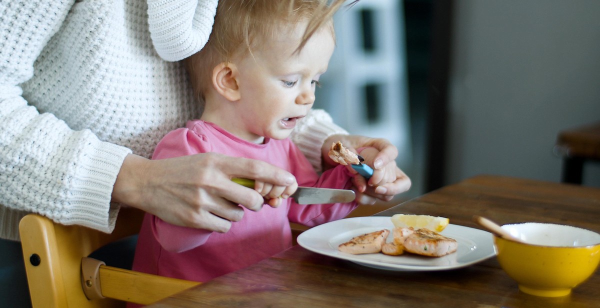 baby eating allergenic food