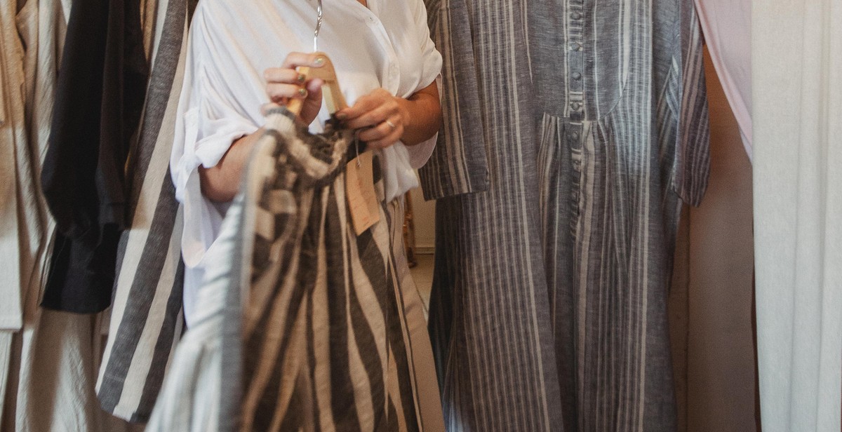 Happy woman with organized wardrobe